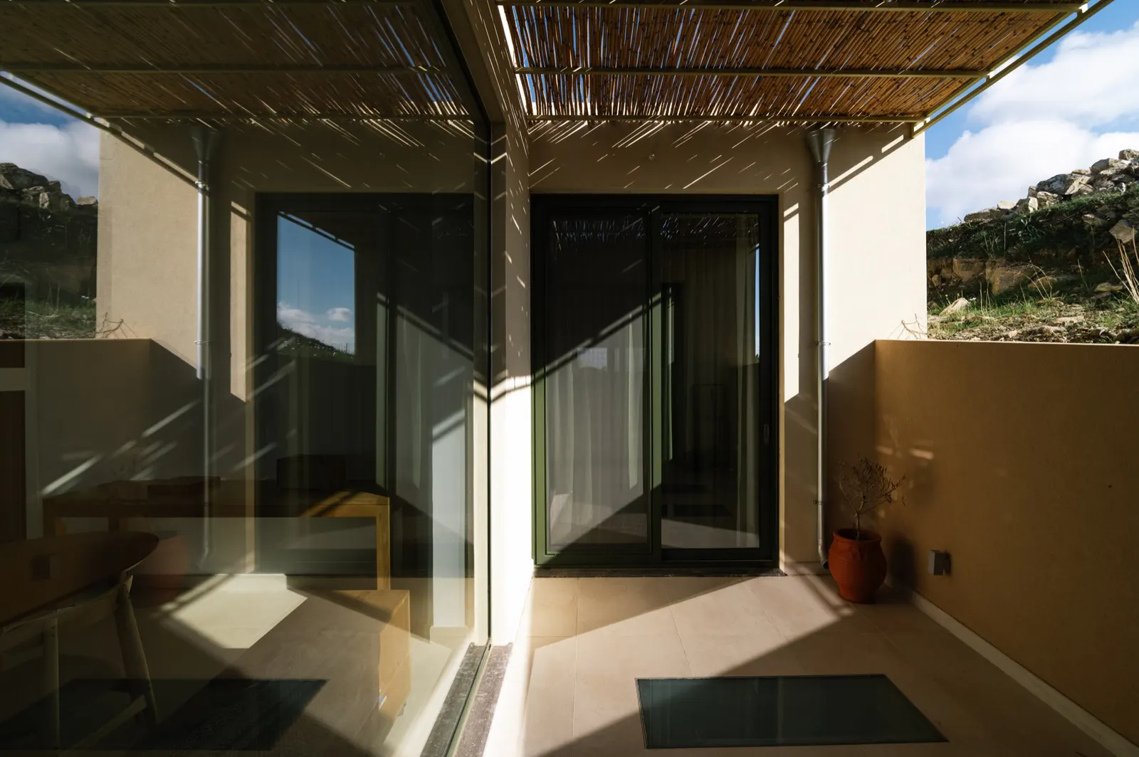 Sheltered patio beside the kitchen, where most meals happen
